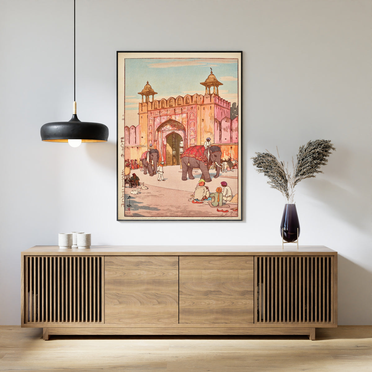Framed art print of The Ajmer Gate at Jaipur by Hiroshi Yoshida, above a slatted wood sideboard