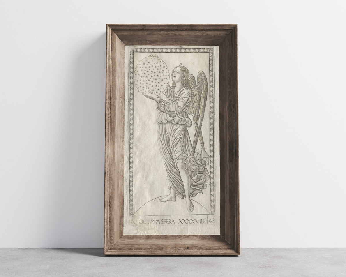 Framed art print of The Angel of the Eighth Sphere (from the… by Master of the E-Series Tarocchi, in a wide wooden frame leaning against a concrete wall