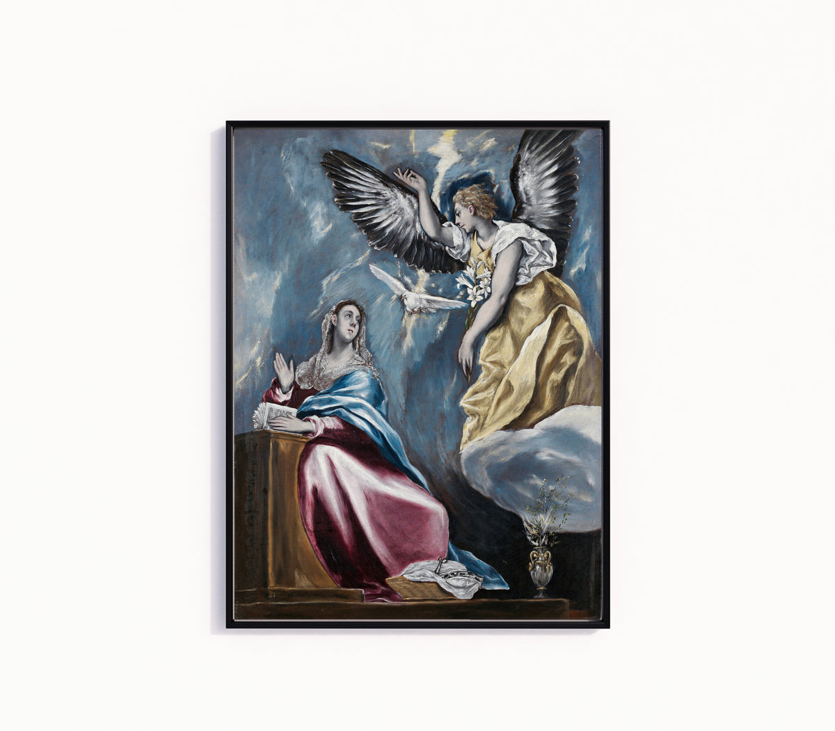 Framed art print of The Annunciation by El Greco, in a slim black frame on a plain white wall