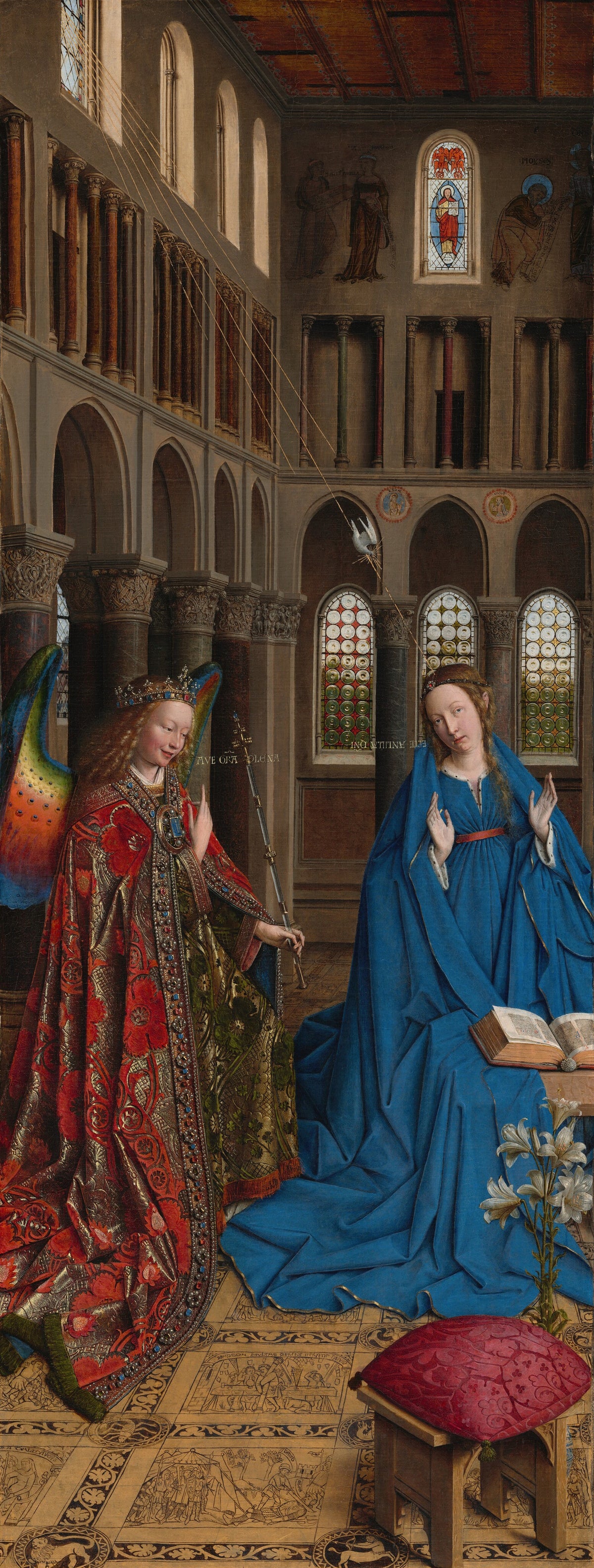 The Annunciation by Jan van Eyck — An angel in jewelled red brocade greets a kneeling Virgin in blue