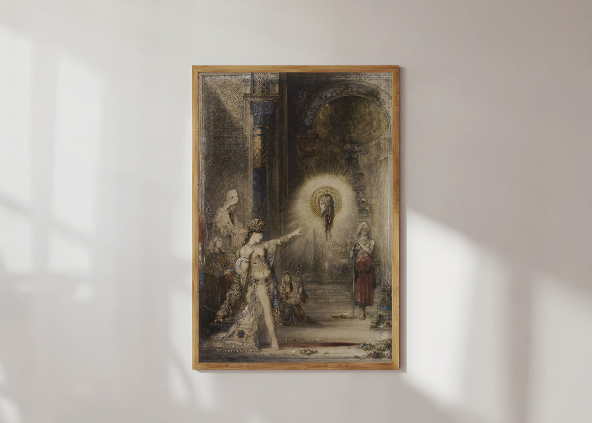 Framed art print of The Apparition by Gustave Moreau, in a light wood frame on a sunlit white wall
