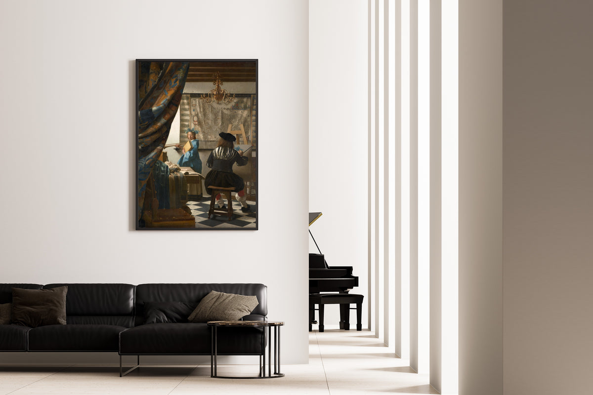 Framed art print of The Art of Painting by Johannes Vermeer, on the wall of a minimal living room