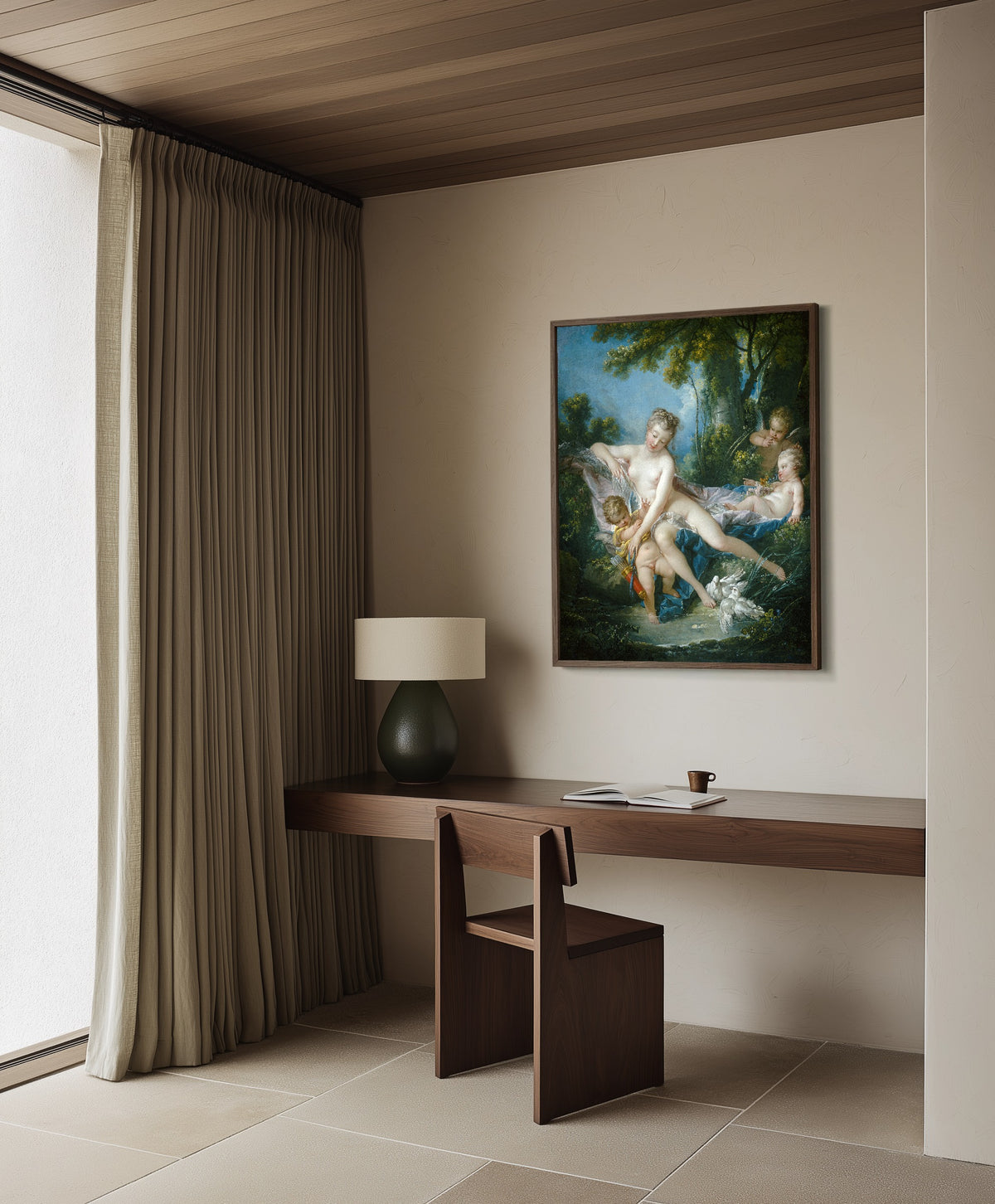 Framed art print of The Bath of Venus by François Boucher, in a dark wood frame on a plaster wall above a walnut desk