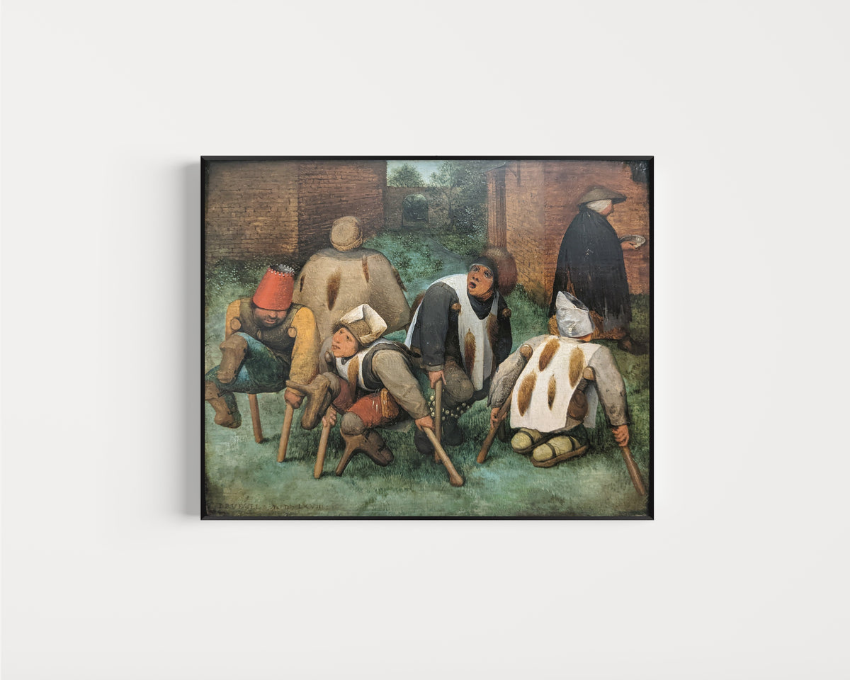 Framed art print of The Beggars by Pieter Bruegel the Elder, in a slim black frame on a plain white wall