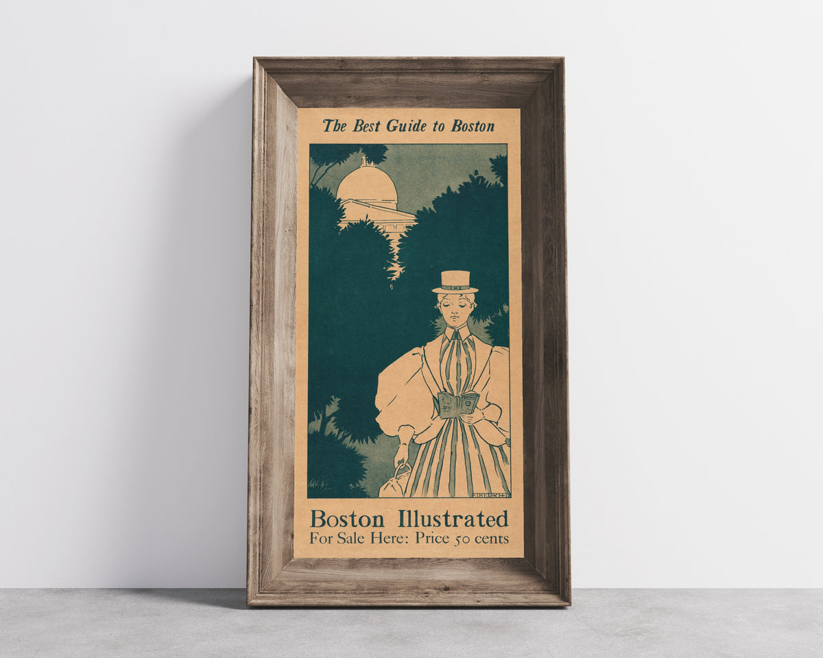Framed art print of The Best Guide to Boston by Ethel Reed, in a wide wooden frame leaning against a concrete wall