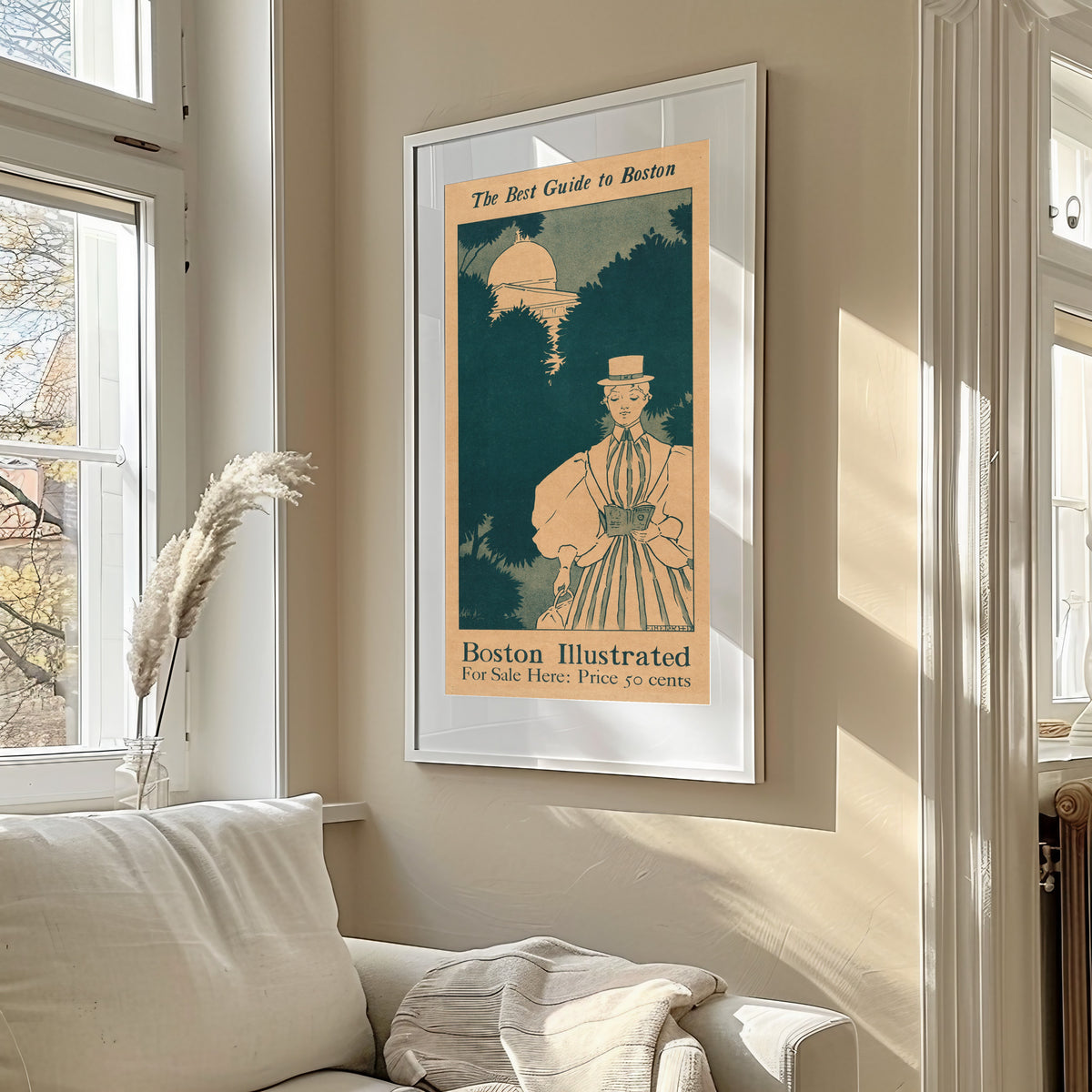 Framed art print of The Best Guide to Boston by Ethel Reed, in a sunlit living room above a sofa