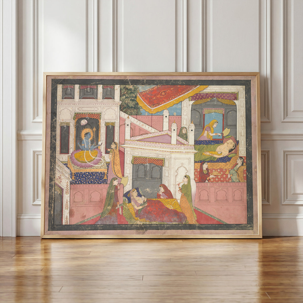Framed art print of The Birth of Rama and His Brothers, from the Bala Kanda of… by Kangra school, in a light wood frame leaning against a panelled white wall