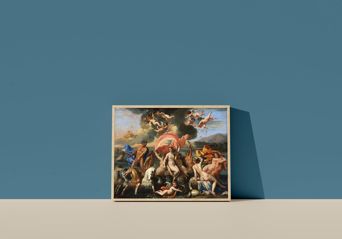 Framed art print of The Birth of Venus by Nicolas Poussin, in a light wood frame leaning on a blue wall