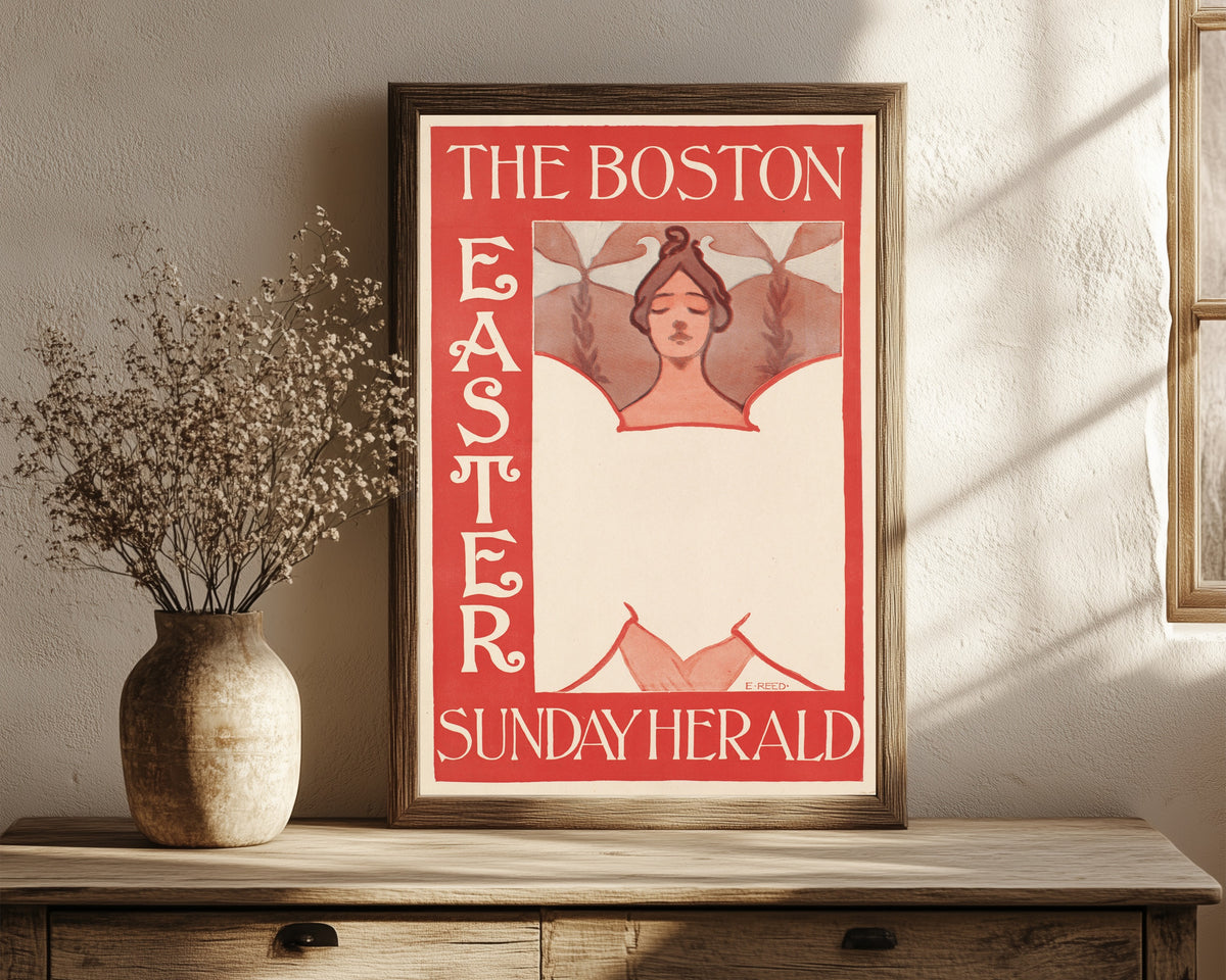 Framed art print of The Boston Sunday Herald, Easter by Ethel Reed, in a dark wood frame leaning on a rustic console beside dried flowers
