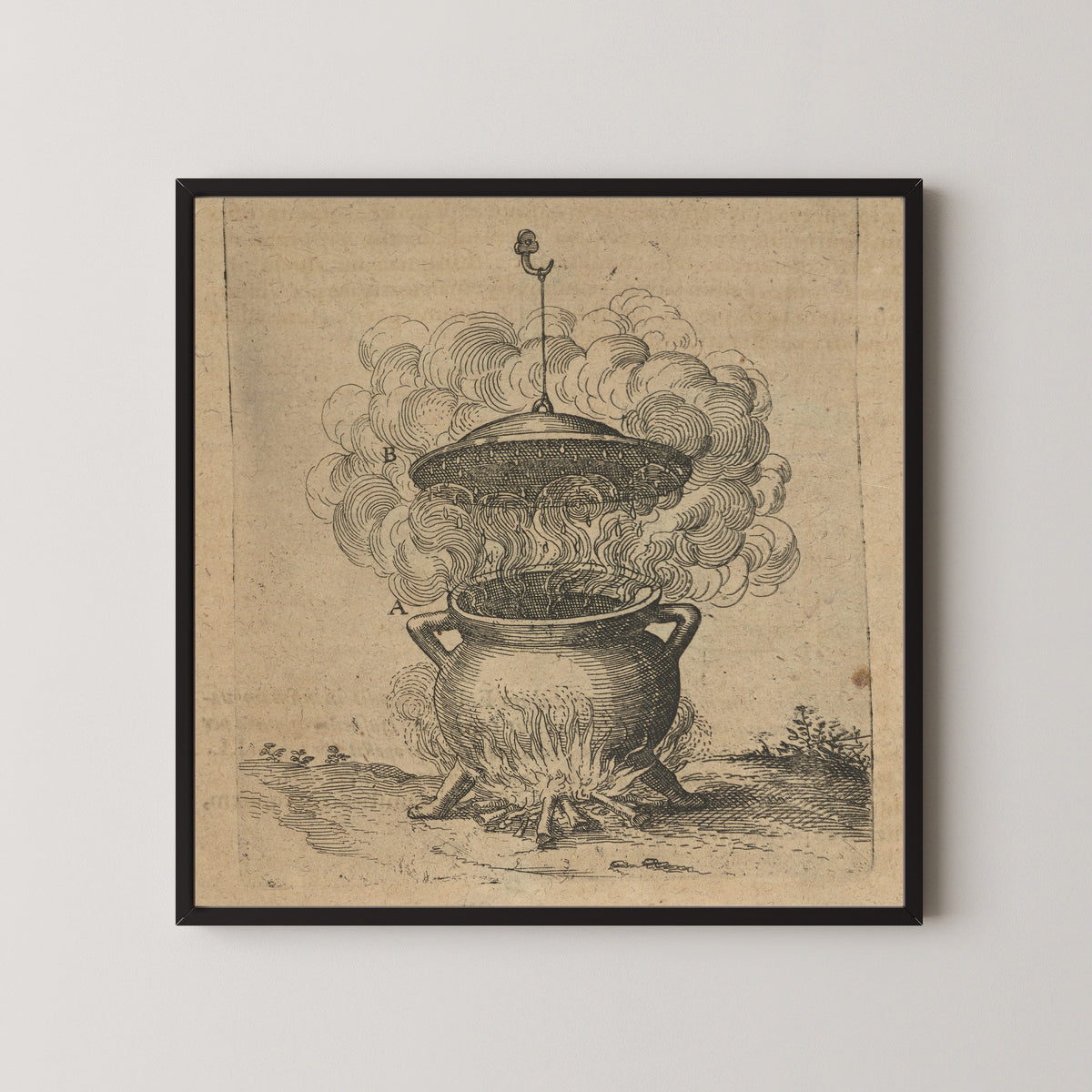 Framed art print of The Cauldron of Imperfect Mixtures over a Fire (Utriusque Cosmi, p. 201) by Robert Fludd, in a black frame on a pale wall