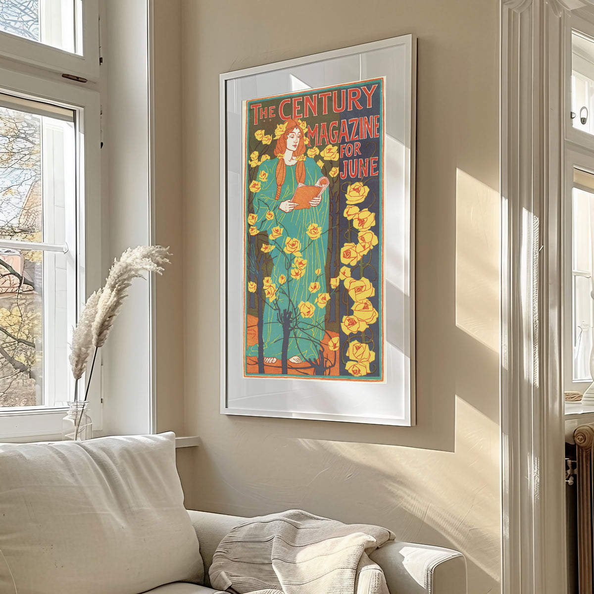 Framed art print of The Century Magazine for June by Louis Rhead, in a sunlit living room above a sofa