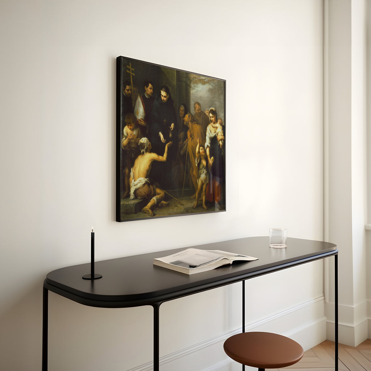 Framed art print of The Charity of Saint Thomas of Villanueva by Bartolomé Esteban Murillo, above a slim black console table