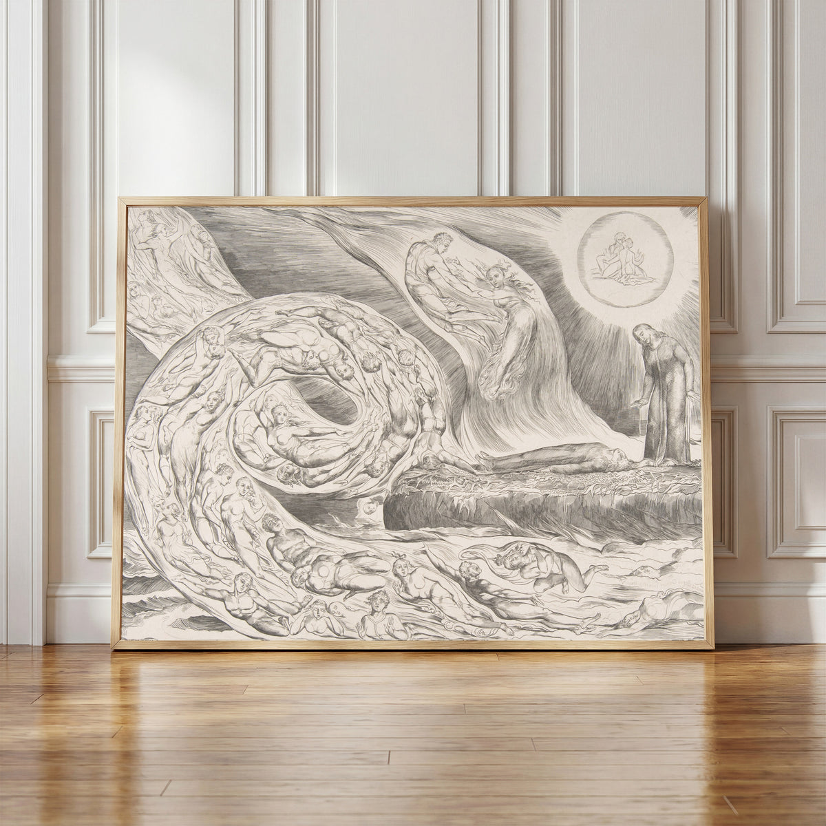 Framed art print of The Circle of the Lustful: Paolo and Francesca by William Blake, in a light wood frame leaning against a panelled white wall