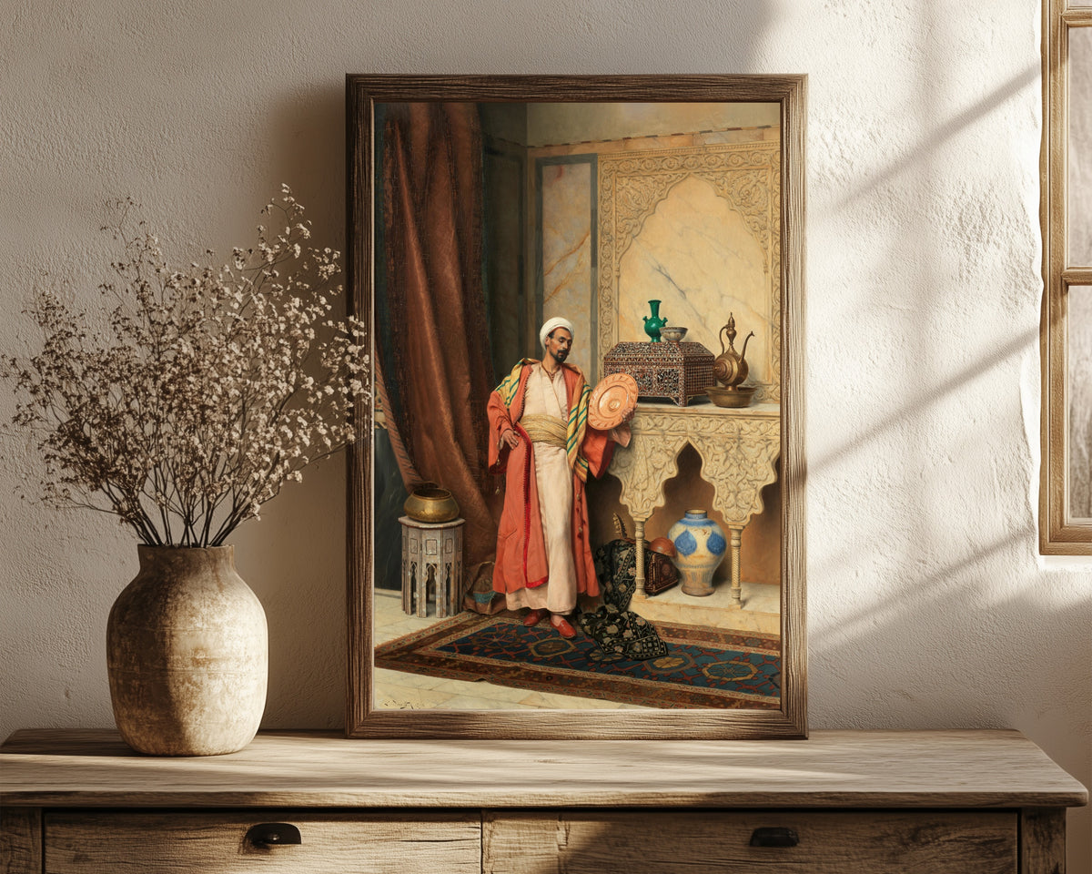 Framed art print of The Connoisseur by Ludwig Deutsch, in a dark wood frame leaning on a rustic console beside dried flowers
