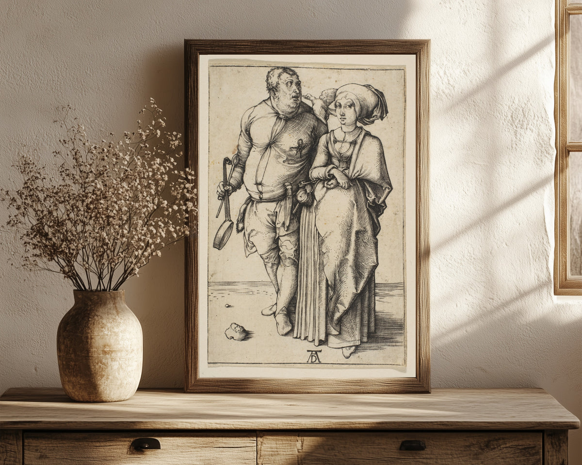 Framed art print of The Cook and His Wife by Albrecht Dürer, in a dark wood frame leaning on a rustic console beside dried flowers