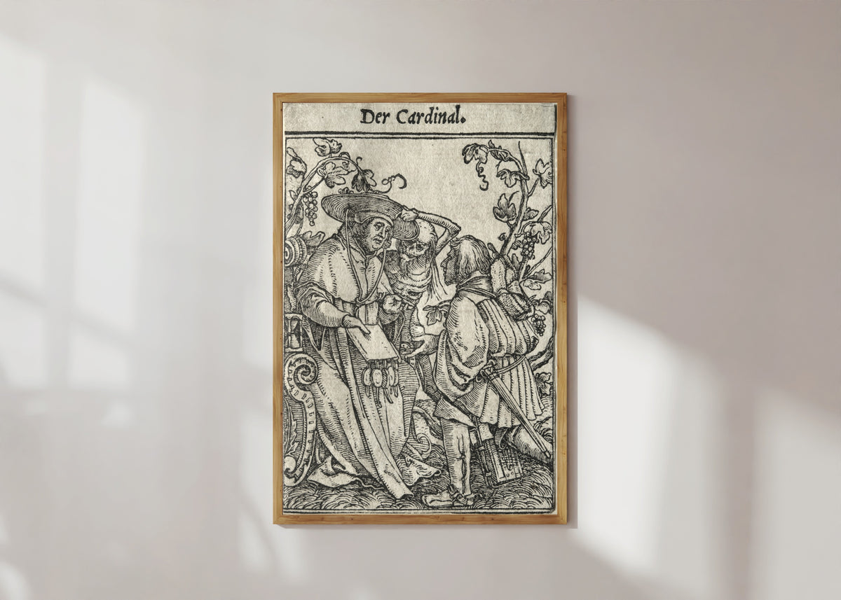 Framed art print of The Dance of Death: Der Cardinal (The Cardinal) by Hans Holbein the Younger, in a light wood frame on a sunlit white wall