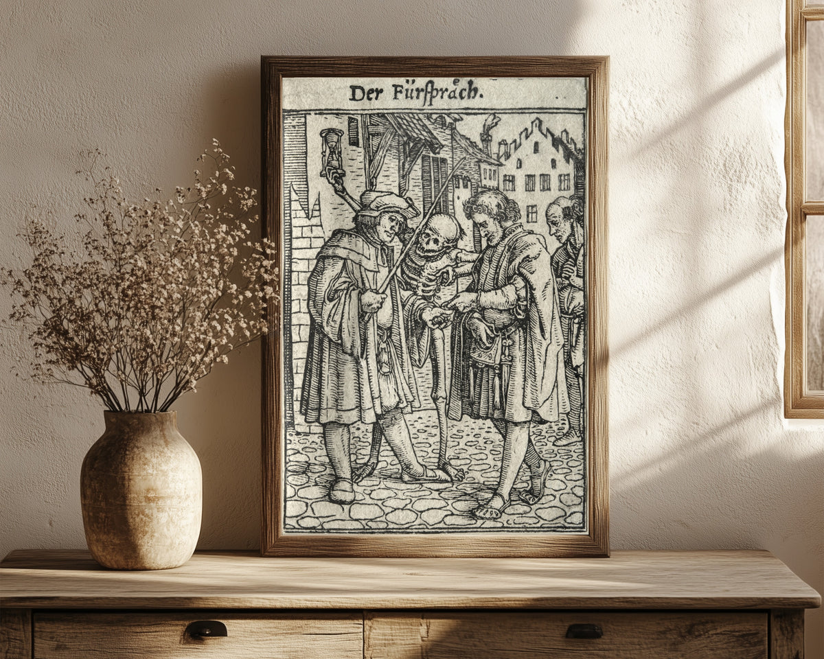 Framed art print of The Dance of Death: Der Fürspräch (The… by Hans Holbein the Younger, in a dark wood frame leaning on a rustic console beside dried flowers