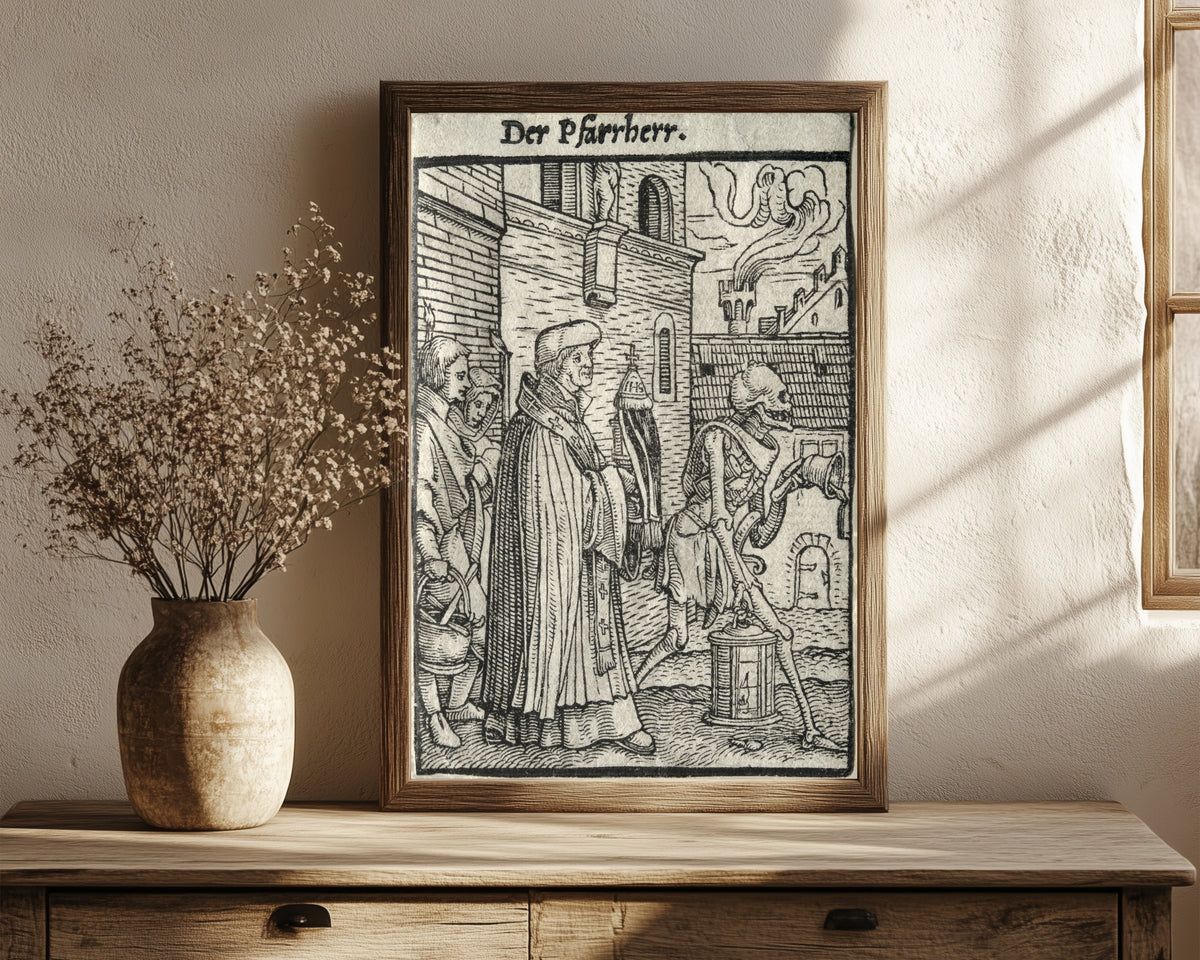 Framed art print of The Dance of Death: Der Pfarrherr (The… by Hans Holbein the Younger, in a dark wood frame leaning on a rustic console beside dried flowers