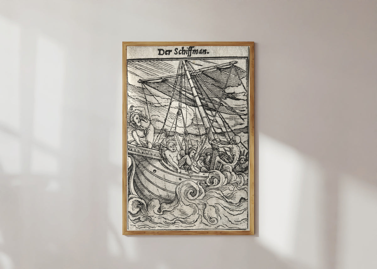 Framed art print of The Dance of Death: Der Schiffman (The Sailor) by Hans Holbein the Younger, in a light wood frame on a sunlit white wall