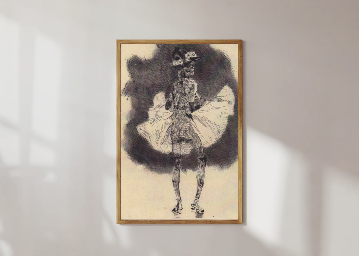 Framed art print of The Dance of Death by Félicien Rops, in a light wood frame on a sunlit white wall