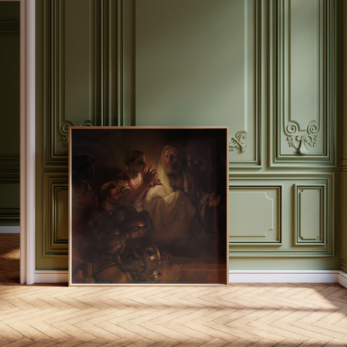 Framed art print of The Denial of St Peter by Rembrandt van Rijn, leaning against olive-green panelling on a herringbone floor