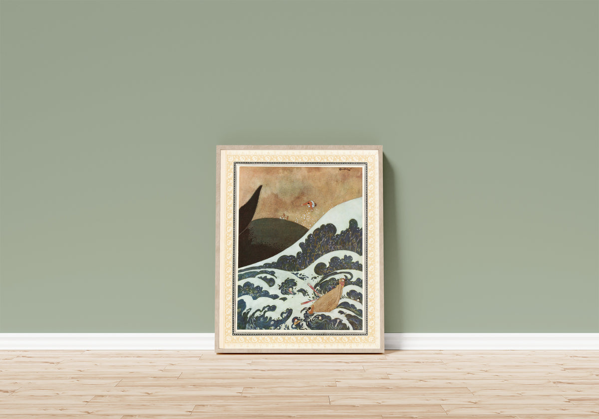 Framed art print of The Episode of the Whale by Edmund Dulac, in a light wood frame leaning on a sage green wall above a wooden floor