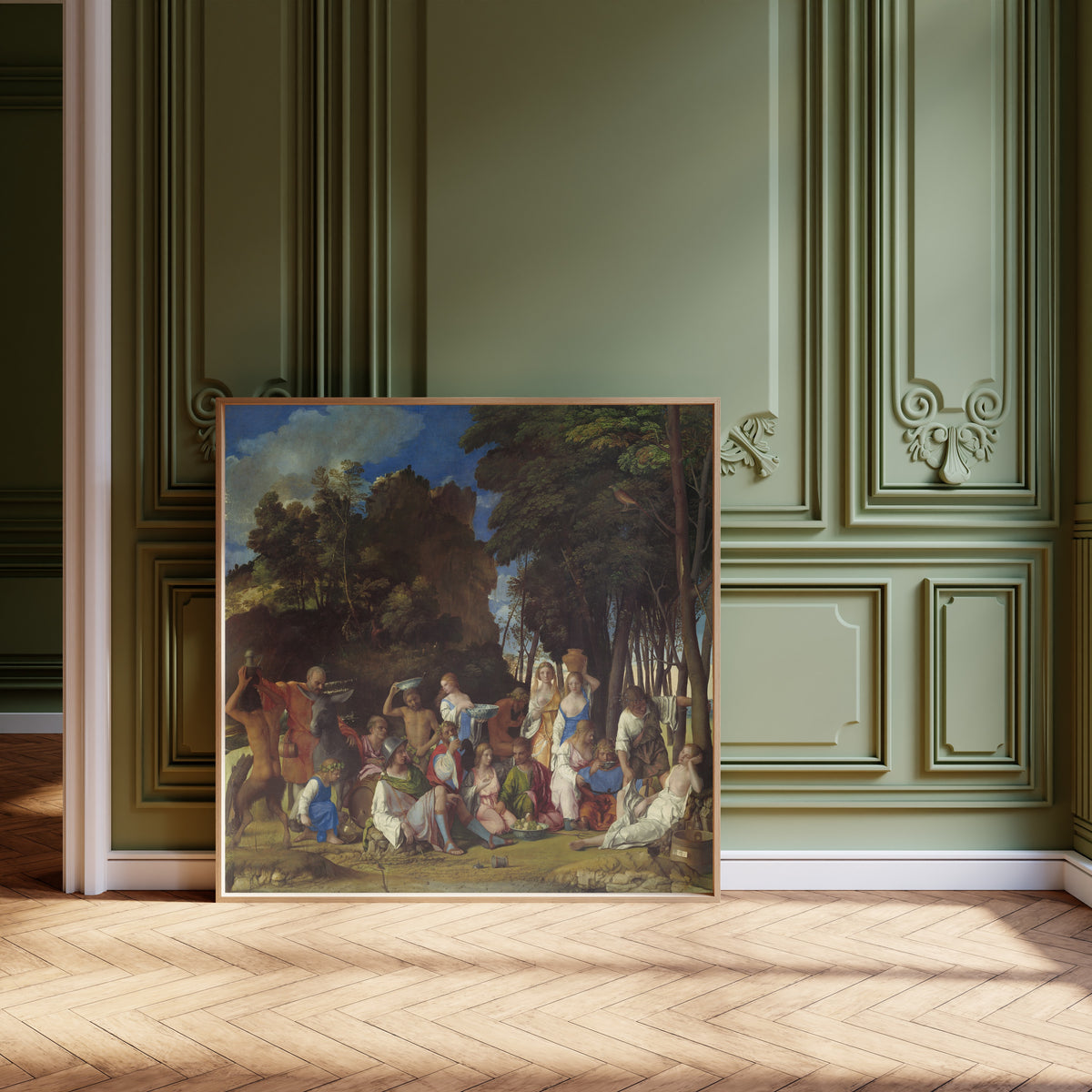 Framed art print of The Feast of the Gods by Giovanni Bellini, leaning against olive-green panelling on a herringbone floor