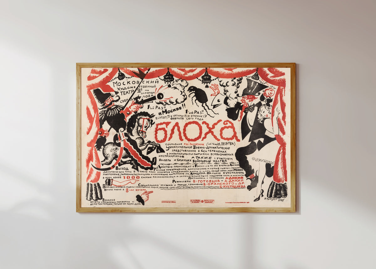 Framed art print of The Flea (Moscow Art Theatre production) by Boris Kustodiev, in a light wood frame on a sunlit white wall