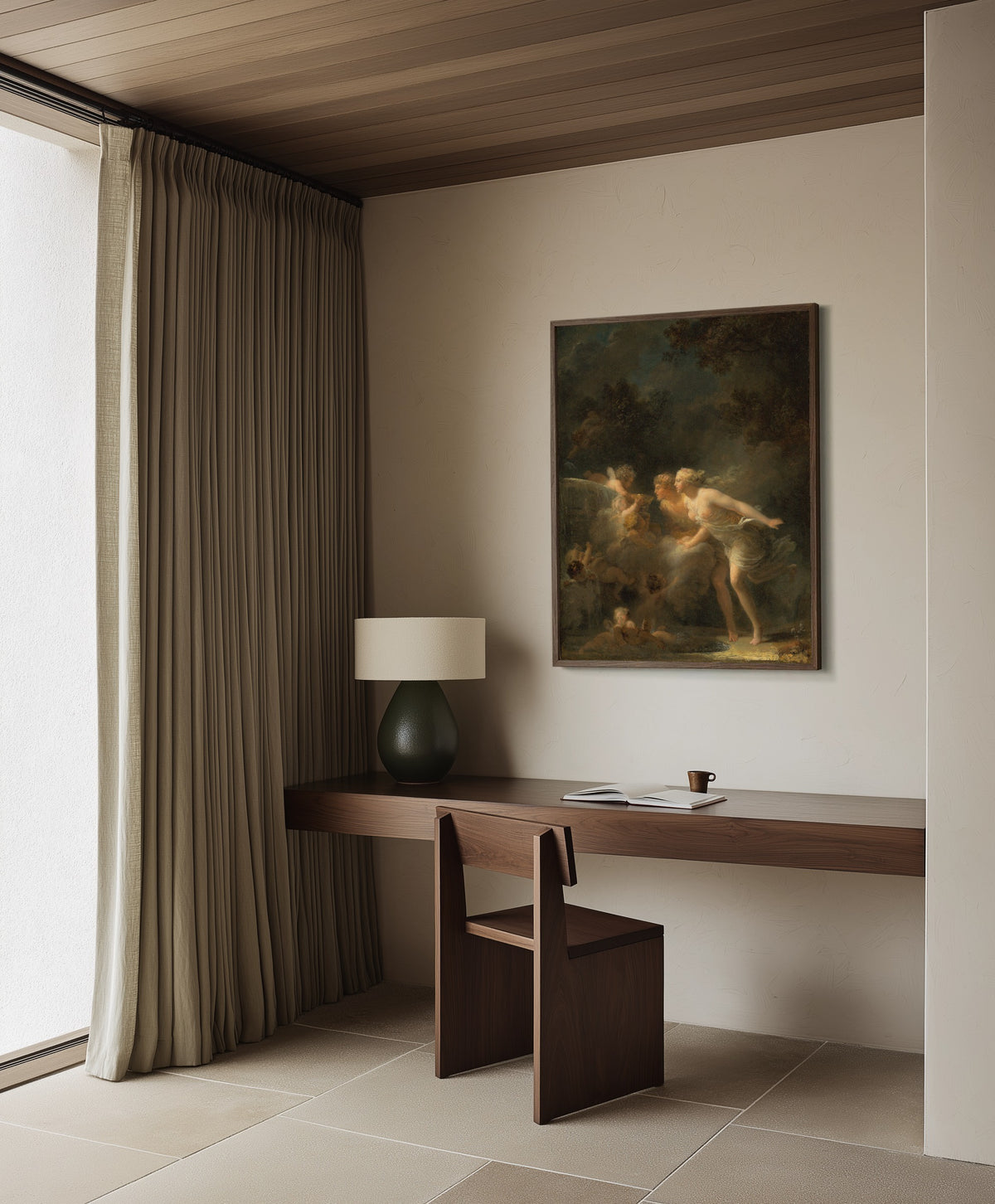 Framed art print of The Fountain of Love by Jean-Honoré Fragonard, in a dark wood frame on a plaster wall above a walnut desk