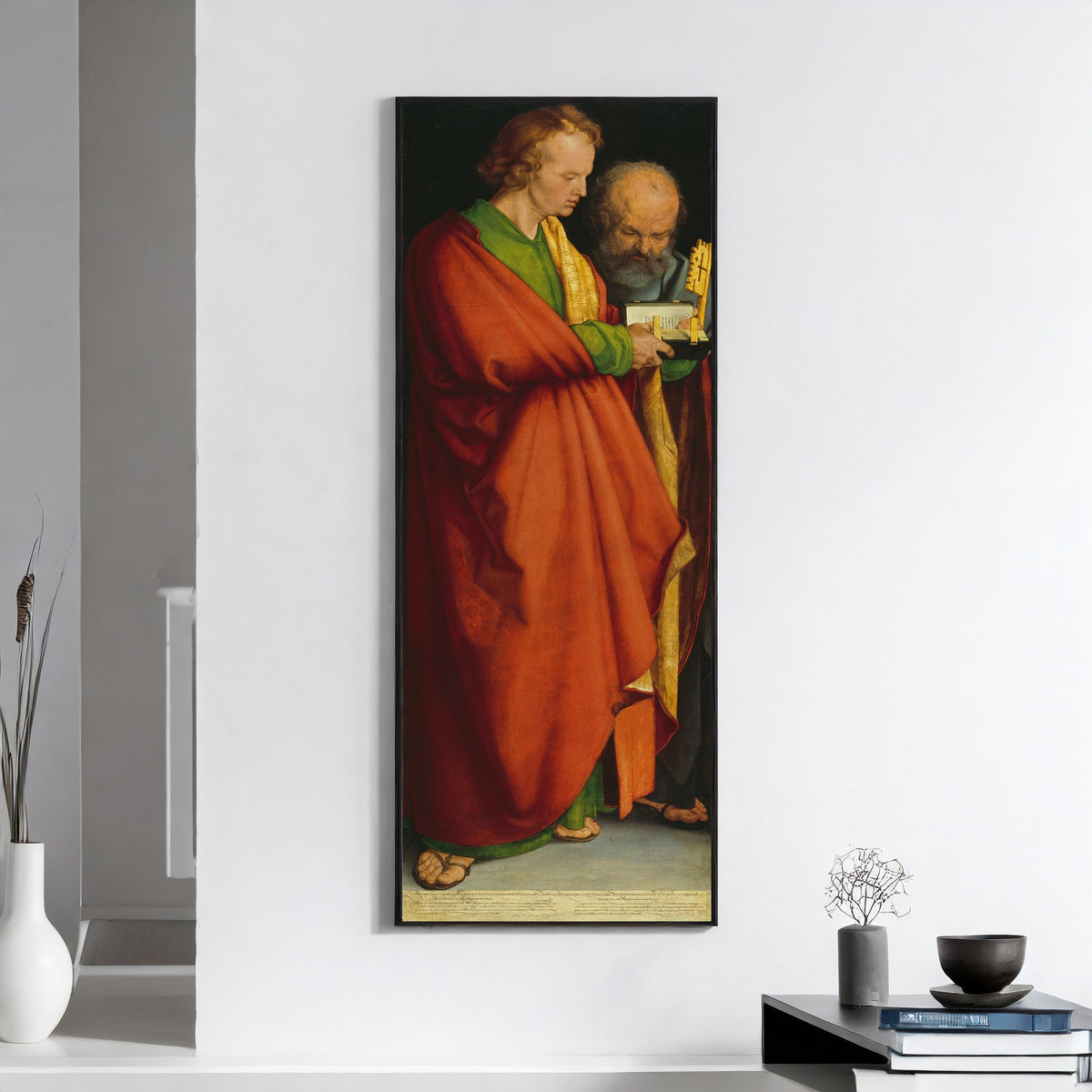 Framed art print of The Four Apostles: St John and St Peter by Albrecht Dürer, on a white wall above books and a bowl