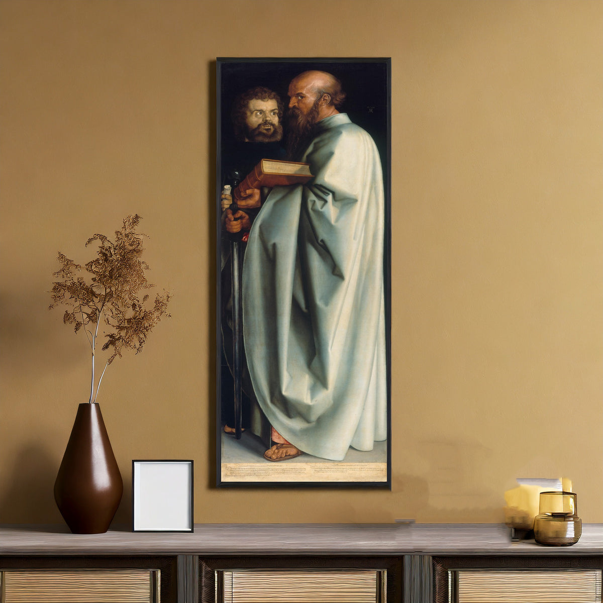 Framed art print of The Four Apostles: St Mark and St Paul by Albrecht Dürer, on an ochre wall above a console table