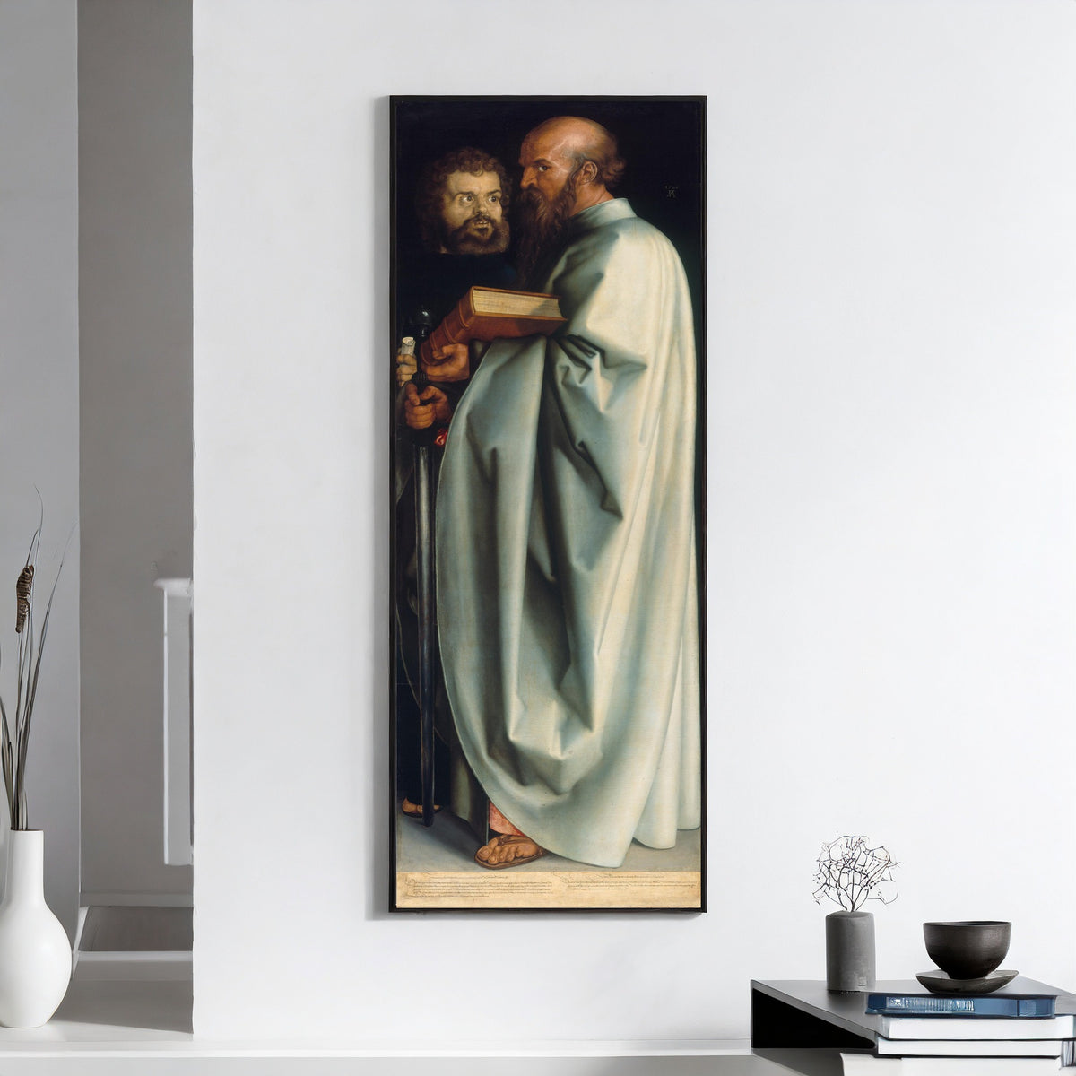Framed art print of The Four Apostles: St Mark and St Paul by Albrecht Dürer, on a white wall above books and a bowl