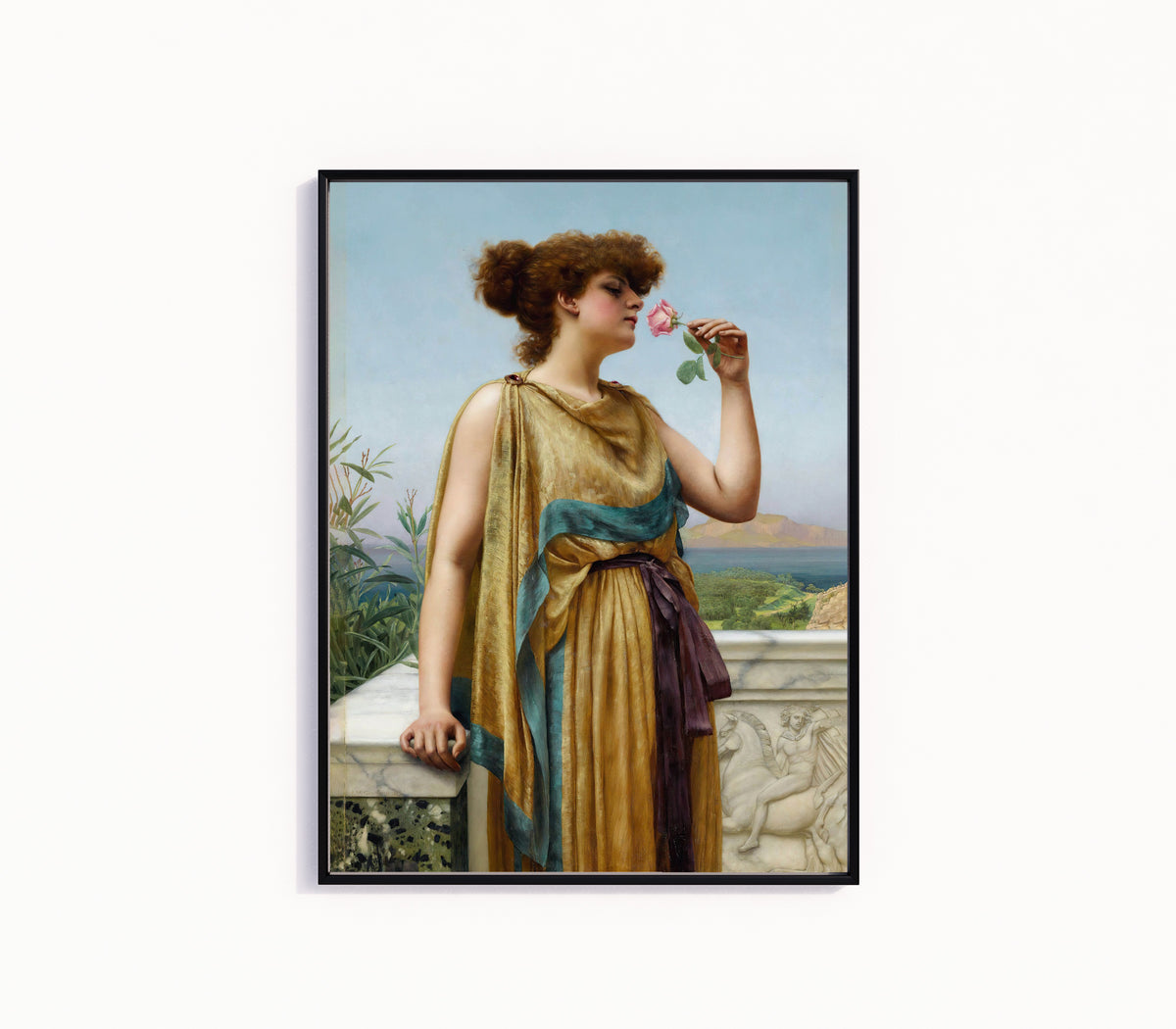 Framed art print of The Fragrant Rose by John William Godward, in a slim black frame on a plain white wall
