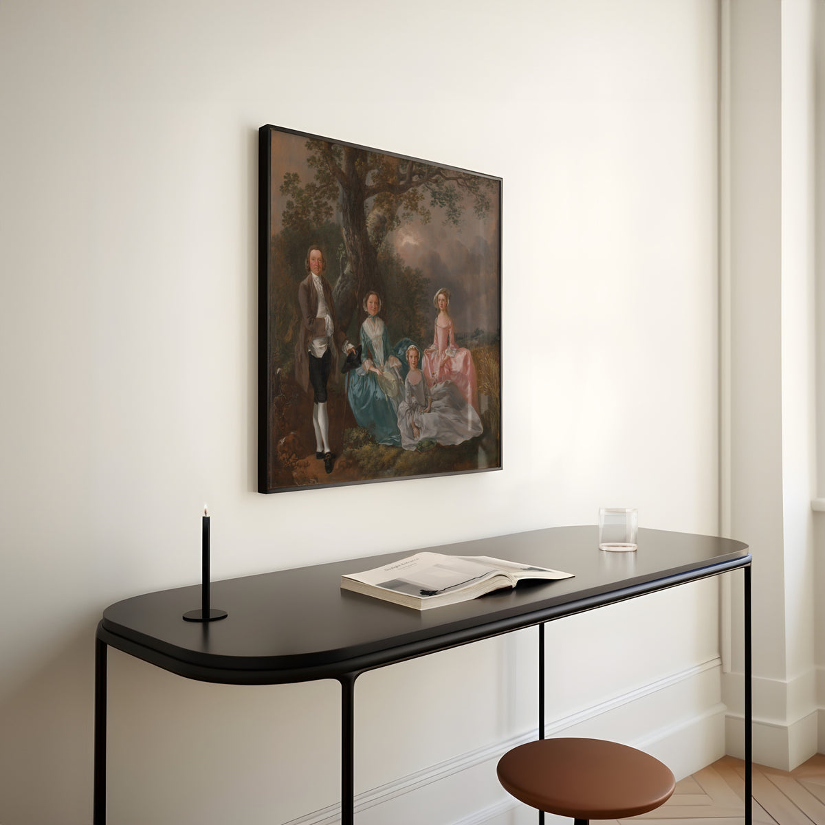 Framed art print of The Gravenor Family by Thomas Gainsborough, above a slim black console table