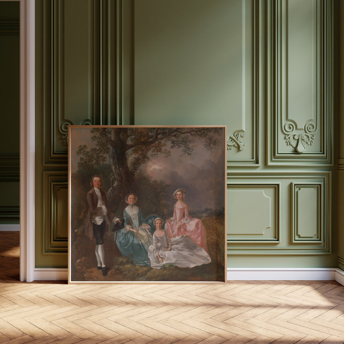 Framed art print of The Gravenor Family by Thomas Gainsborough, leaning against olive-green panelling on a herringbone floor