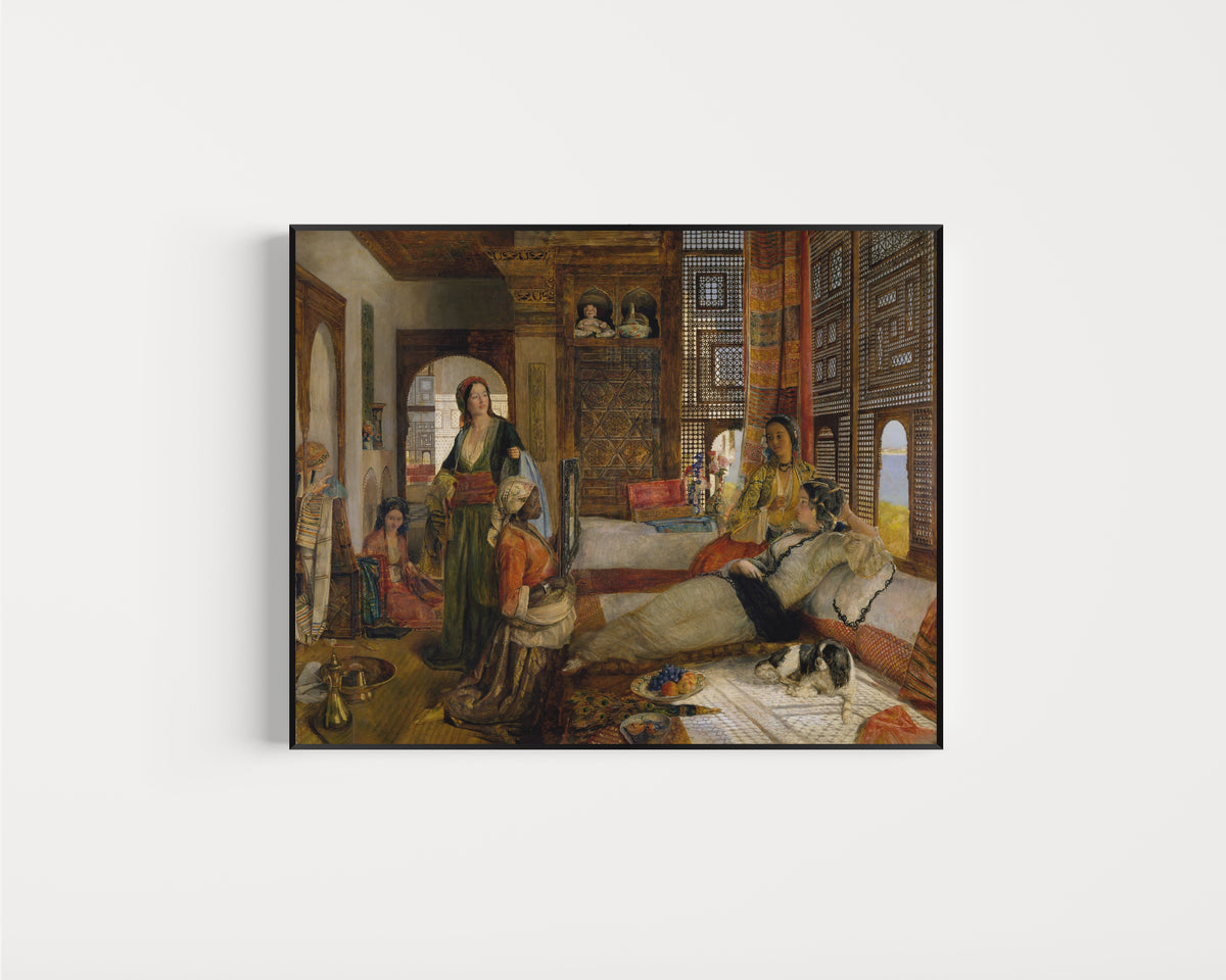 Framed art print of The Harem by John Frederick Lewis, in a slim black frame on a plain white wall