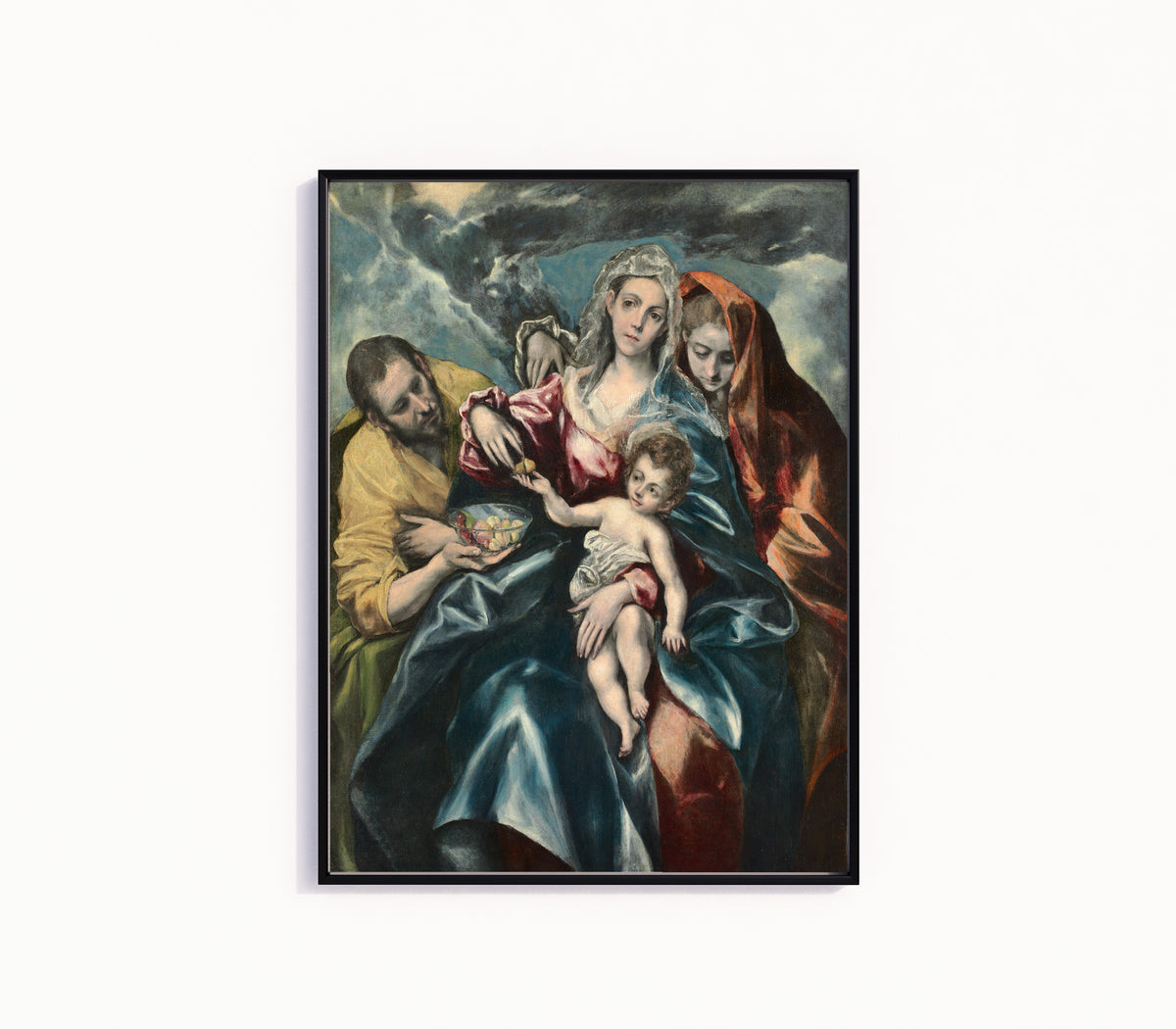 Framed art print of The Holy Family with Mary Magdalen by El Greco, in a slim black frame on a plain white wall