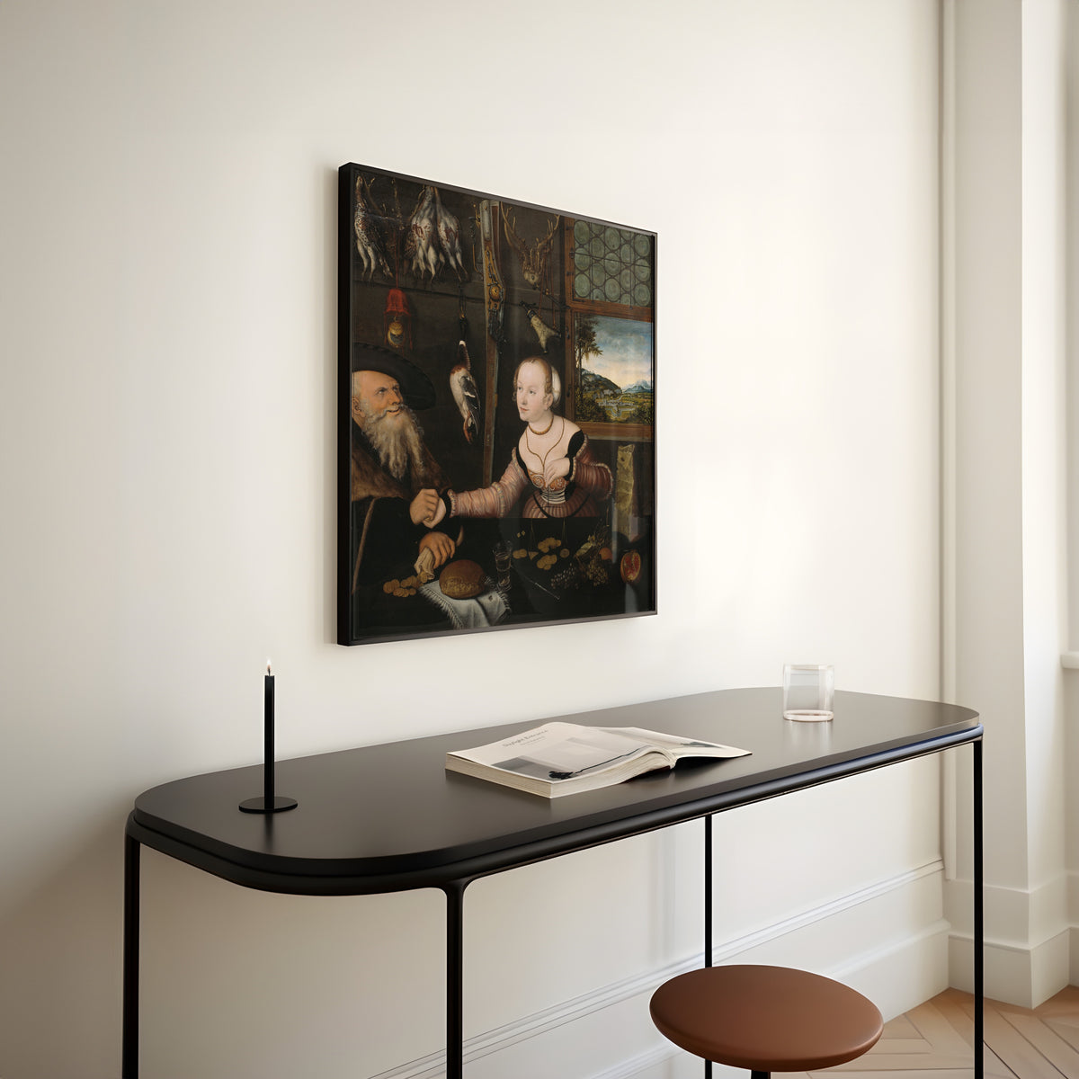 Framed art print of The Ill-matched Couple by Lucas Cranach the Elder, above a slim black console table
