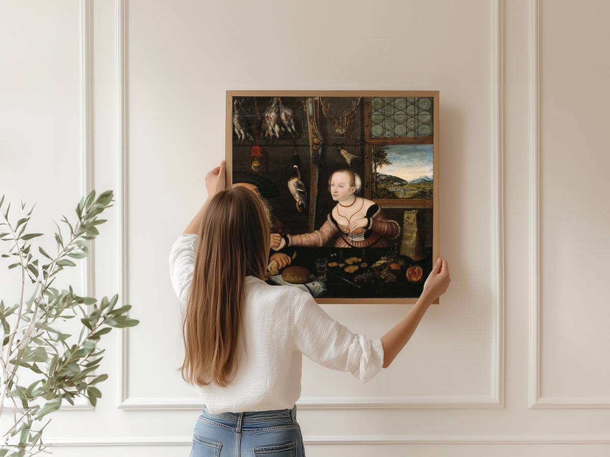 Framed art print of The Ill-matched Couple by Lucas Cranach the Elder, hung on a panelled wall