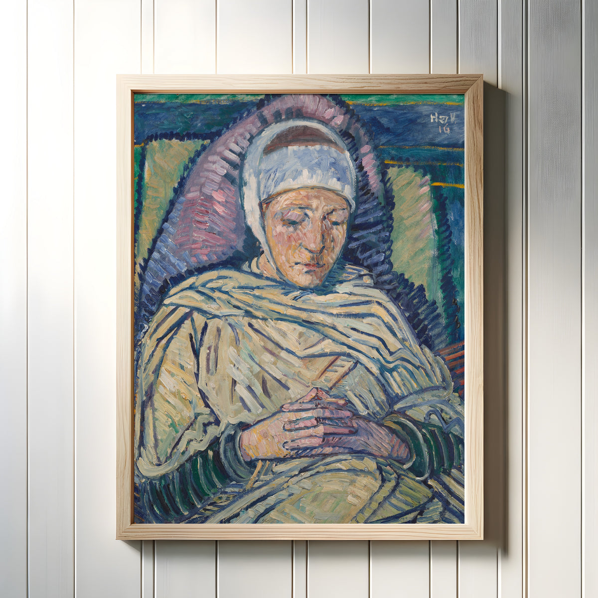 Framed art print of The Invalid by Heinrich Vogeler, in a light wood frame on a white panelled wall