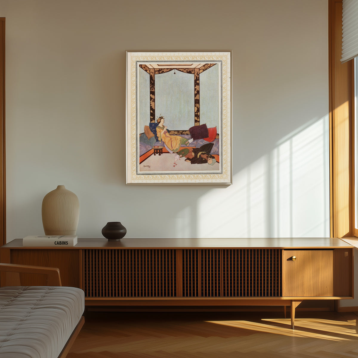 Framed art print of The Lady Bedr-el-Budur and the wicked Magician by Edmund Dulac, in a thin light frame on a sunlit wall above a wooden sideboard