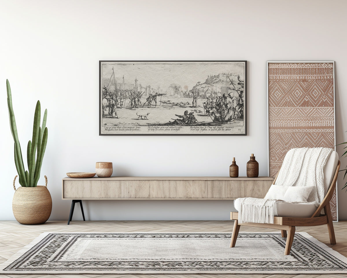 Framed art print of The Large Miseries of War: The Firing Squad by Jacques Callot, above a sideboard in a living room