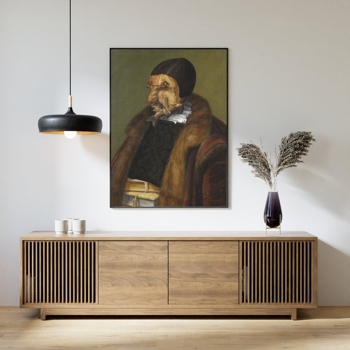 Framed art print of The Lawyer by Giuseppe Arcimboldo, above a slatted wood sideboard