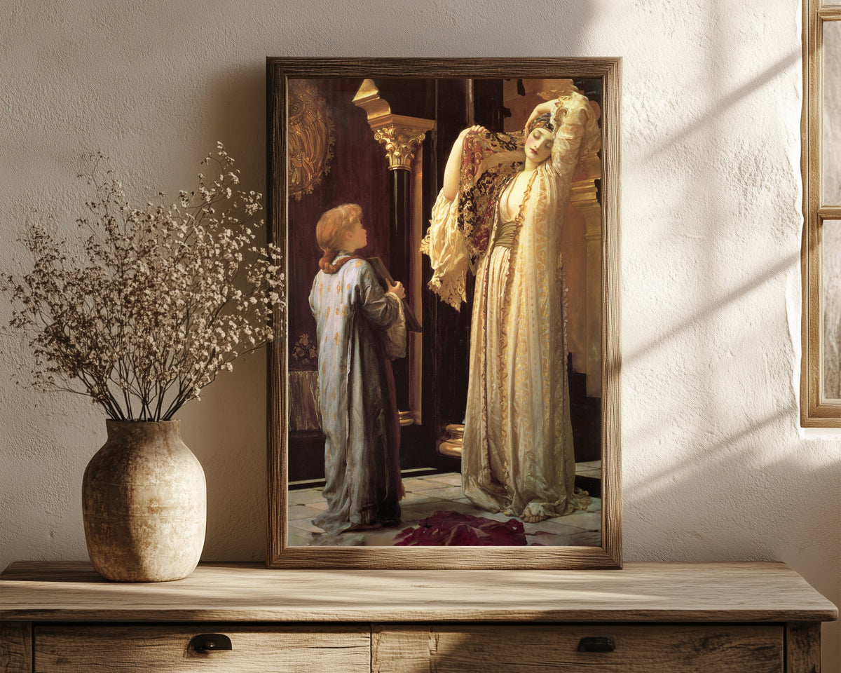 Framed art print of The Light of the Harem by Frederic Leighton, in a dark wood frame leaning on a rustic console beside dried flowers