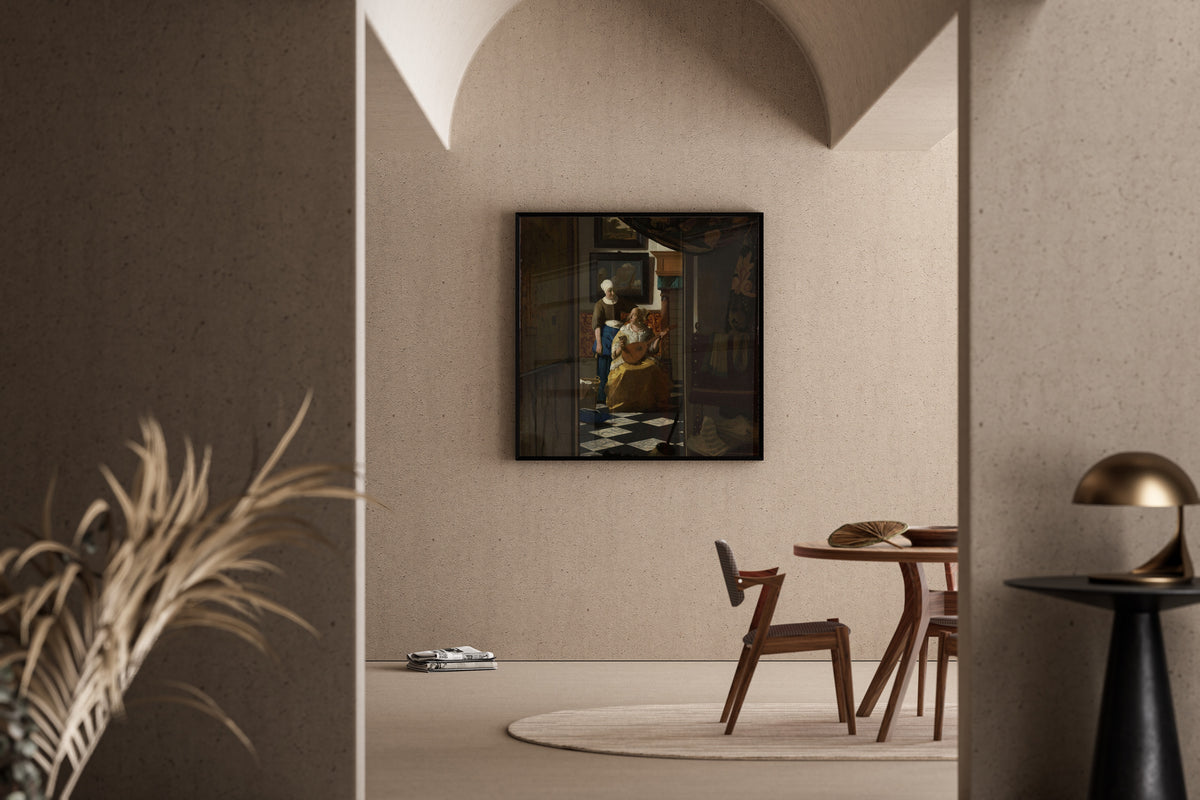 Framed art print of The Love Letter by Johannes Vermeer, in a sunlit dining corner