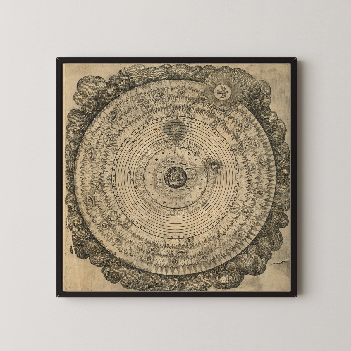 Framed art print of The Macrocosm: Concentric Spheres in Clouds (Utriusque Cosmi, Tractatus Primus) by Robert Fludd, in a black frame on a pale wall