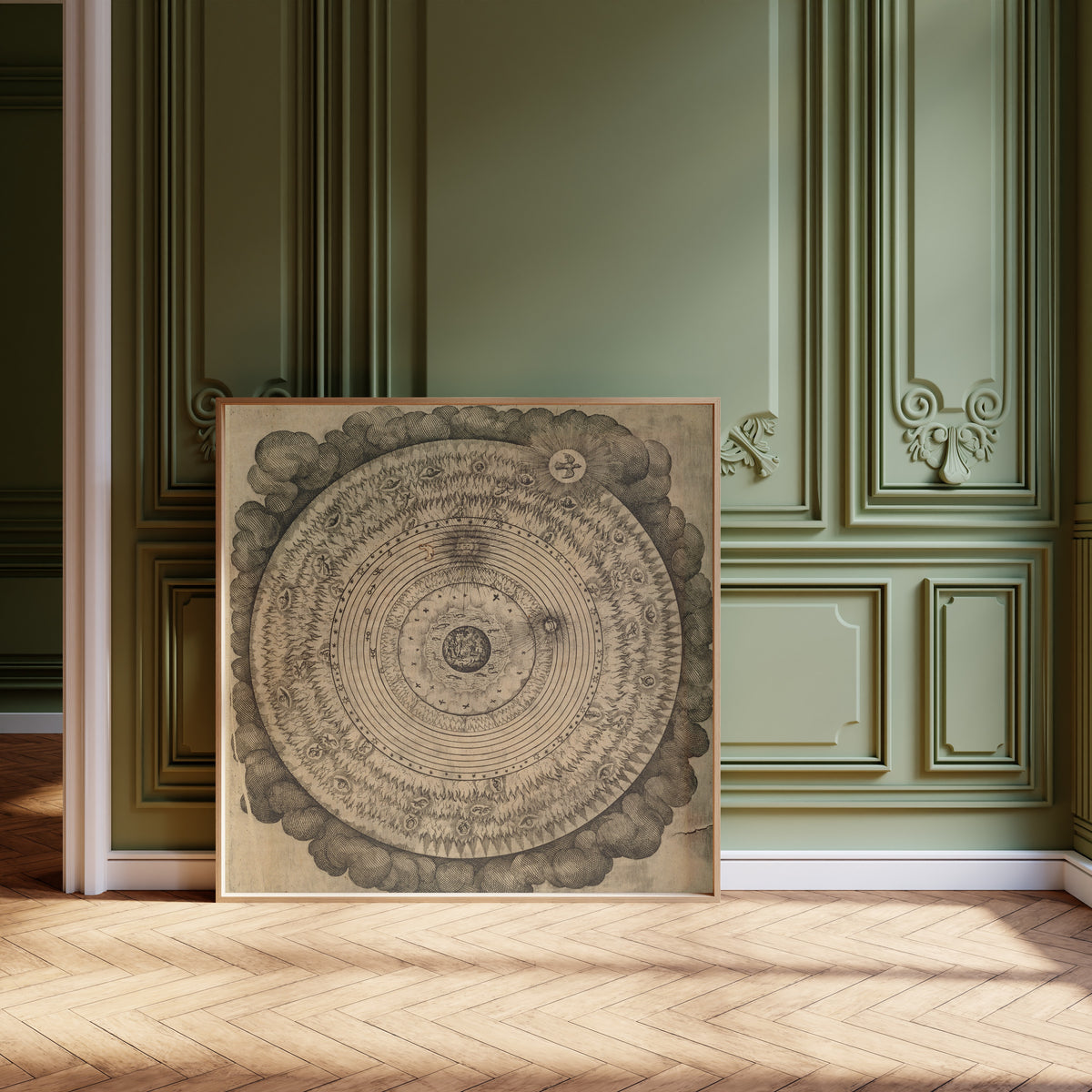 Framed art print of The Macrocosm: Concentric Spheres in Clouds (Utriusque… by Robert Fludd, leaning against olive-green panelling on a herringbone floor