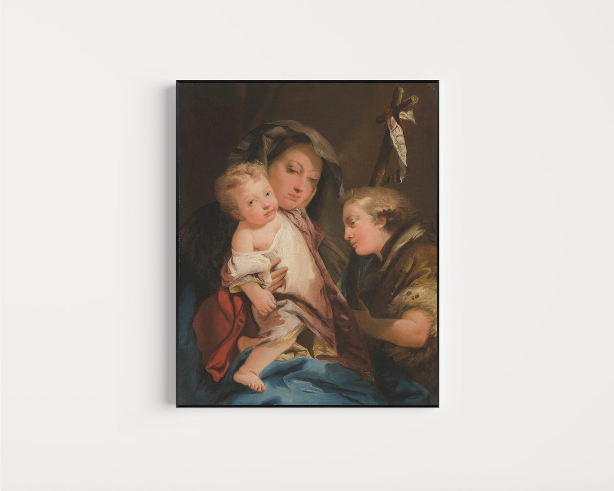 Framed art print of The Madonna and Child with the Infant Saint John the Baptist by Giovanni Domenico Tiepolo, in a slim black frame on a plain white wall