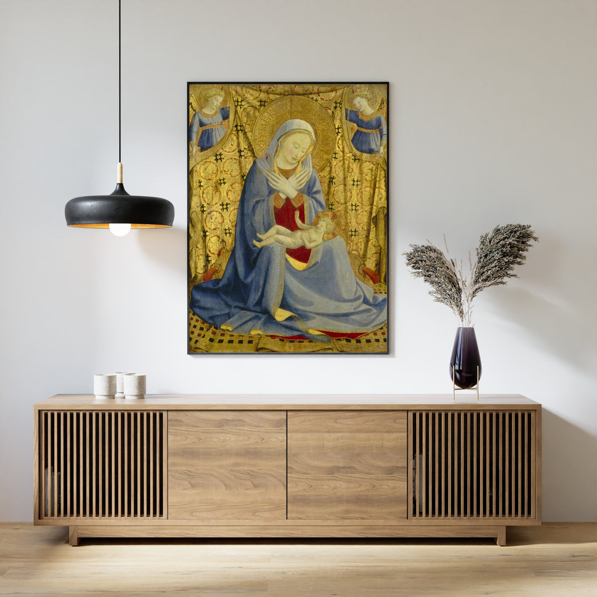 Framed art print of The Madonna of Humility by Fra Angelico, above a slatted wood sideboard