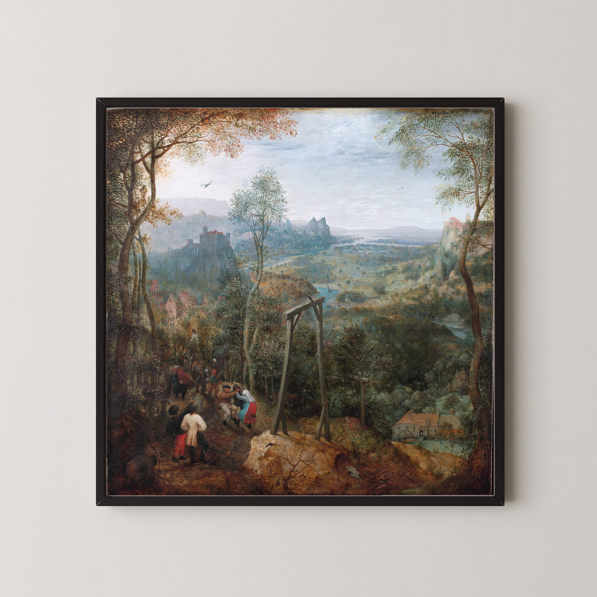 Framed art print of The Magpie on the Gallows by Pieter Bruegel the Elder, in a black frame on a pale wall